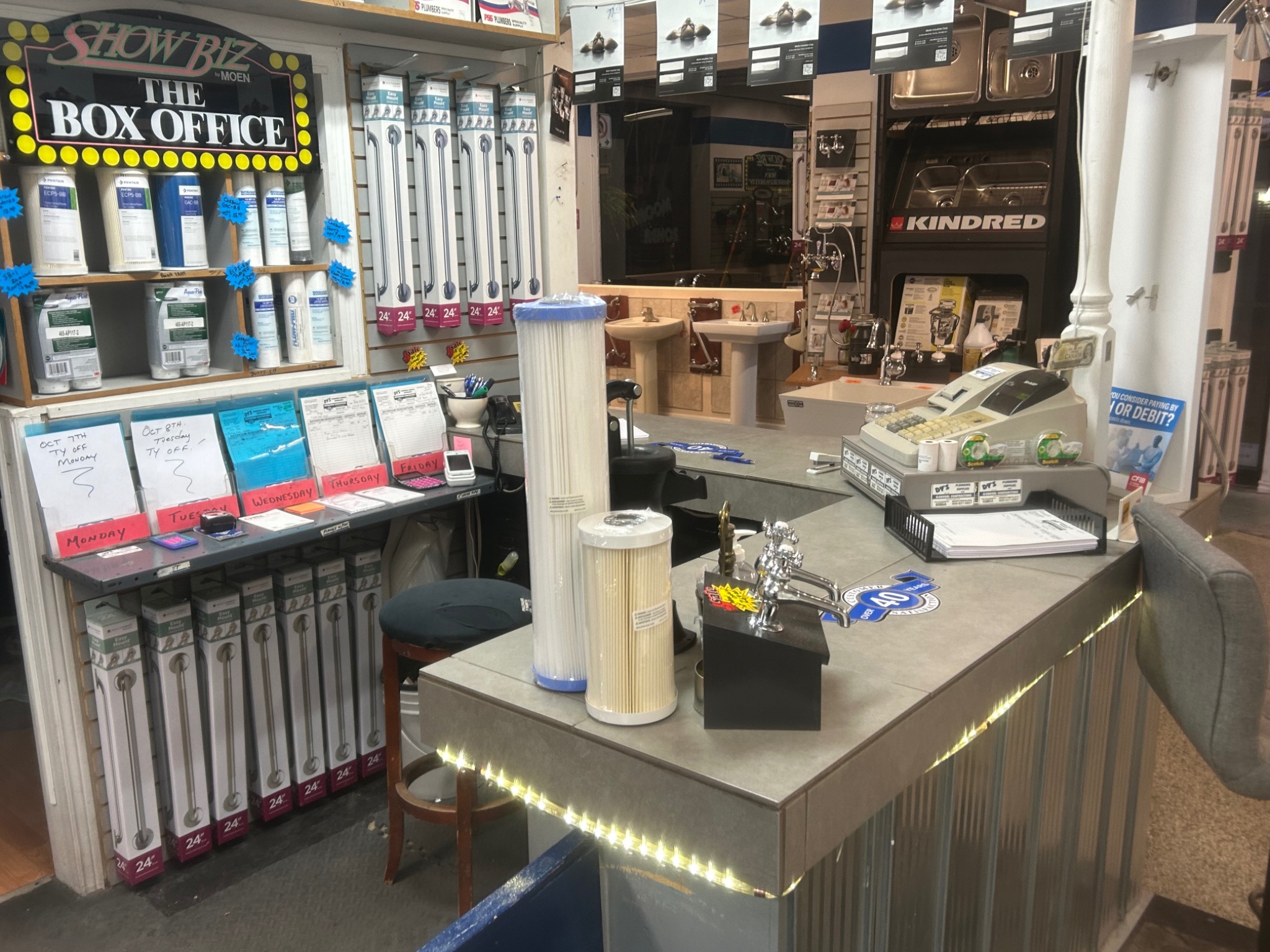 Dy's Plumbing service counter and product display